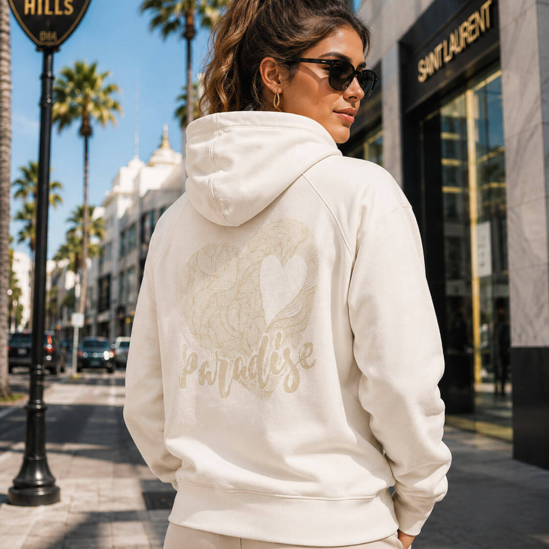 Unisex beige cotton hoodie by ADIP with hand-drawn heart artwork and Los Angeles finish